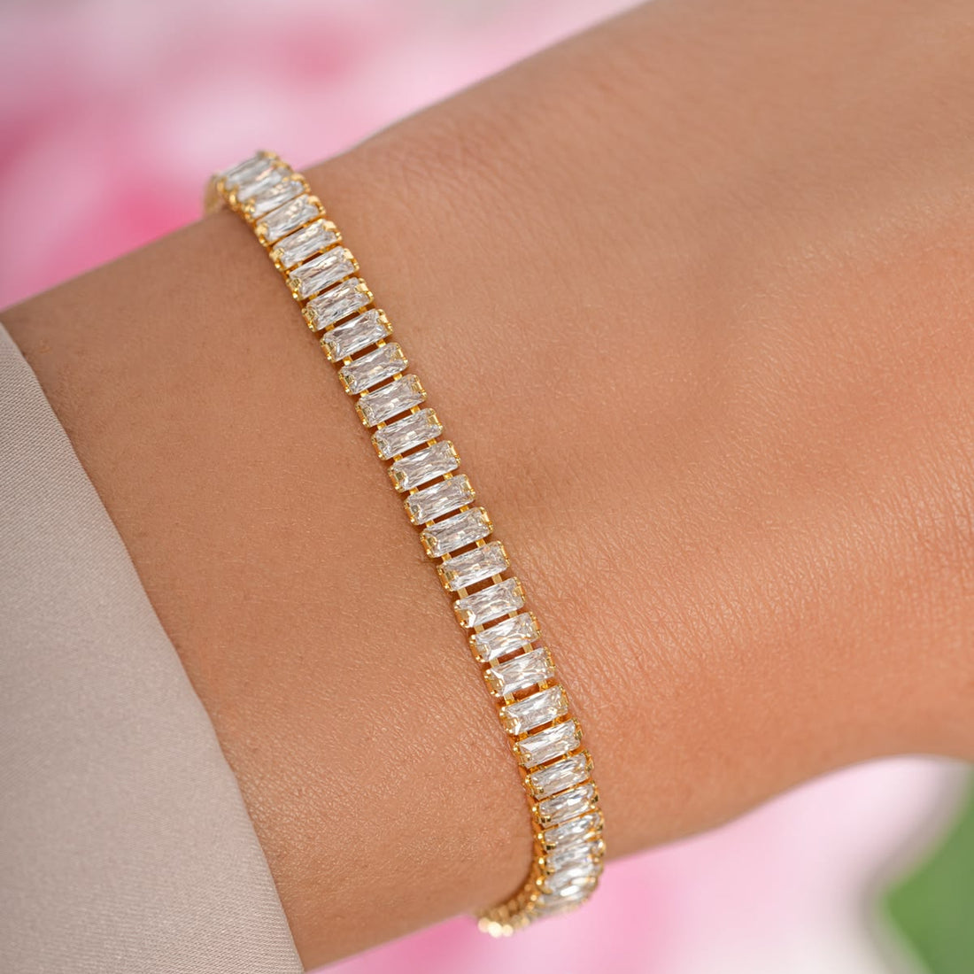 Aura tennis bracelet, gold-tone imitation bracelet with a line of rectangular baguette crystals