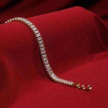Aura tennis bracelet, gold-tone imitation bracelet with a line of rectangular baguette crystals