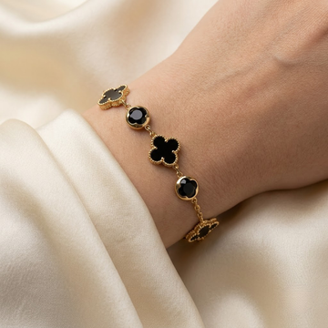 Clover Bracelet, five black clovers on a gold-tone imitation chain