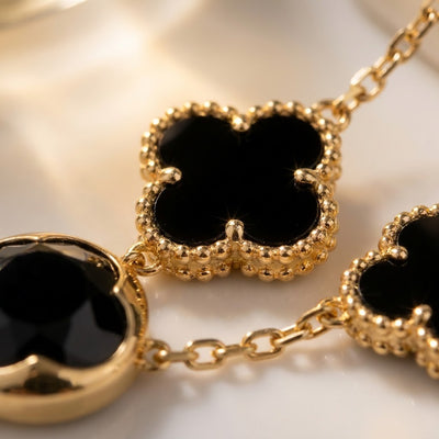 Clover Bracelet, five black clovers on a gold-tone imitation chain, view 2 of 2